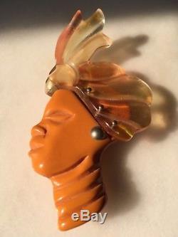 African face brooch wearing turban and jewels, large vintage, bakelite pin