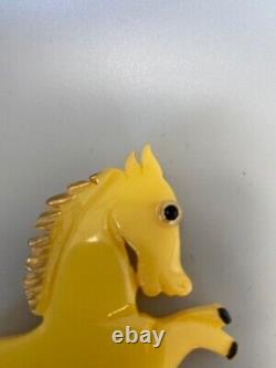 JL Foltz Carved Yellow Bakelite Equestrian Leaping Horse Glass Eye Brooch Pin