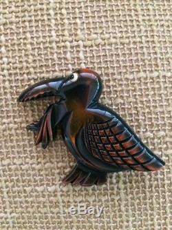 RARE vintage BAKELITE pin overdye pelican with fish in his mouth