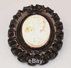 VINTAGE PIN With CARVED SHELL CAMEO ON LARGE OVAL BLACK CARVED BAKELITE BACKGROUND
