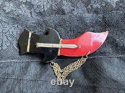 Vintage carved Bakelite sword pin Thief of Baghdad chain pin brooch 1940's